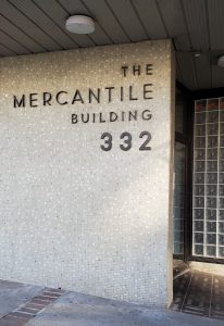 Image of white tiled building with the text The Mercantile Building 332